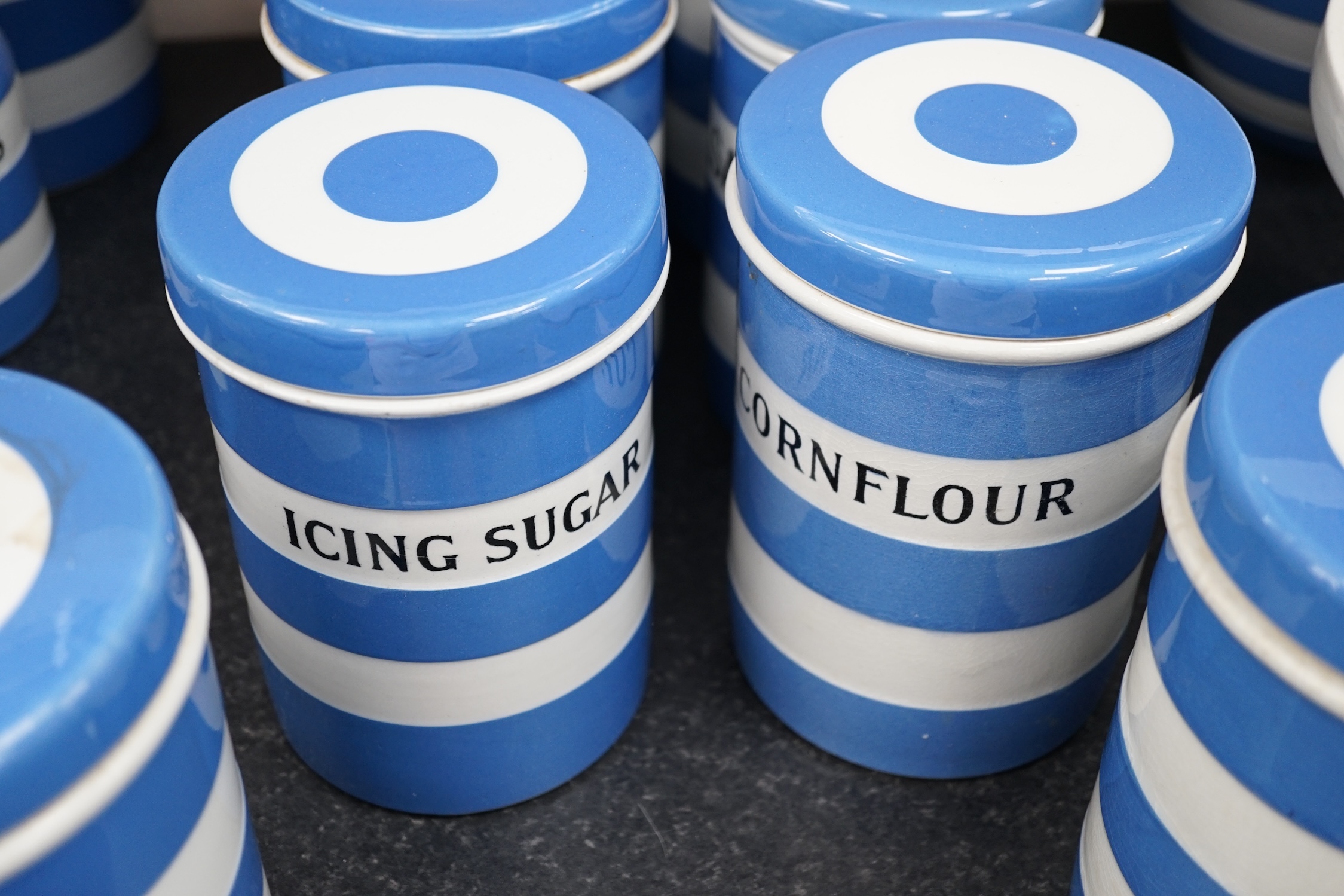 T.G.Green Cornish Kitchenware, ten 17.5cm lidded storage jars to include Prunes, Candied Peel, Loaf Sugar and Ground Rice, Green Church marks. Condition - fair to good